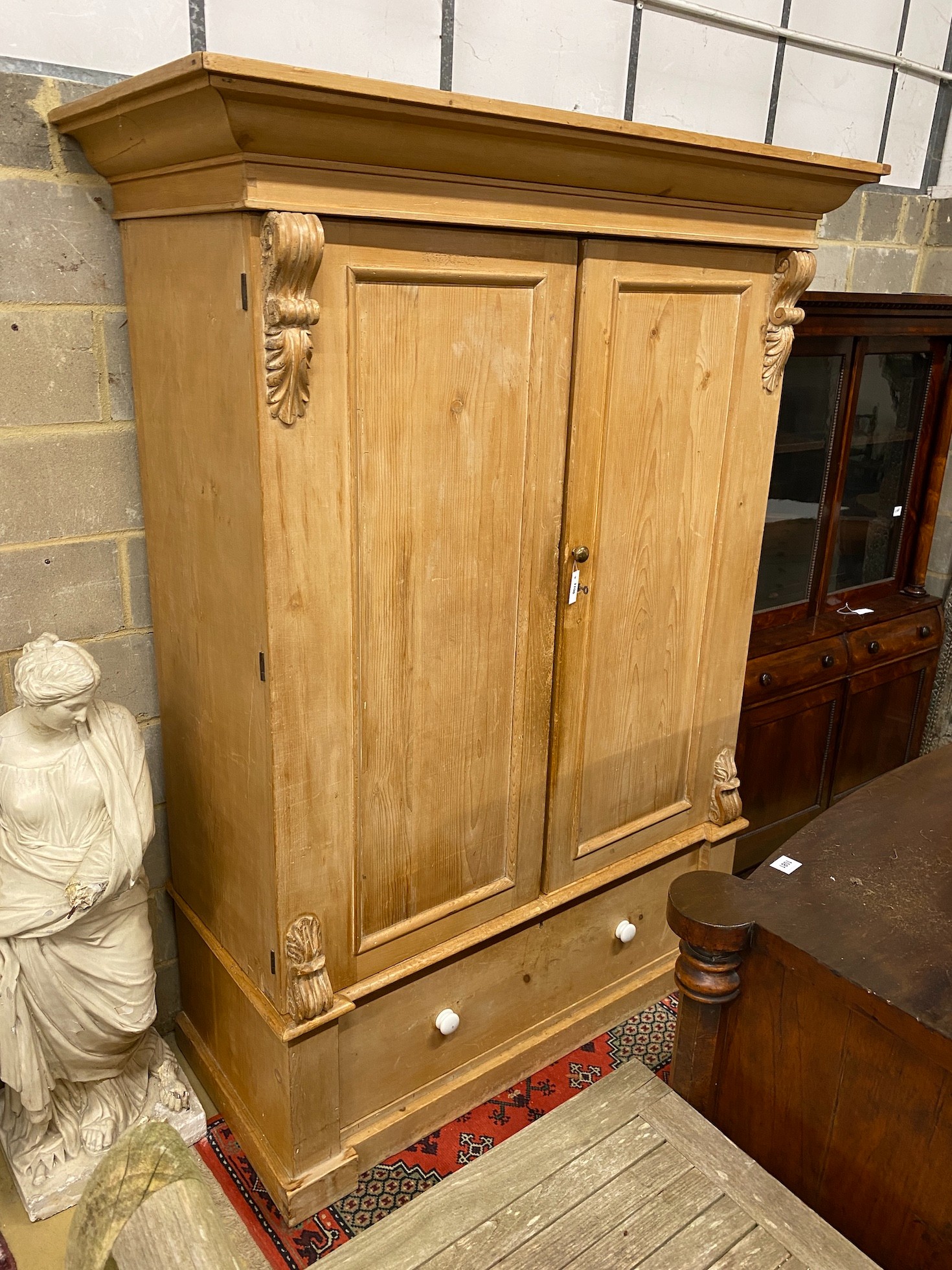 An Edwardian pine wardrobe, width 158cm, height 216cm